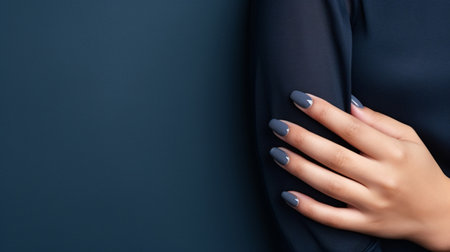 Glamour woman hand with navy blue nail polish on her fingernails. Navy nail manicure with gel polish at luxury beauty salon. Nail art and design. Female hand model. French manicure. Generative AI.の素材