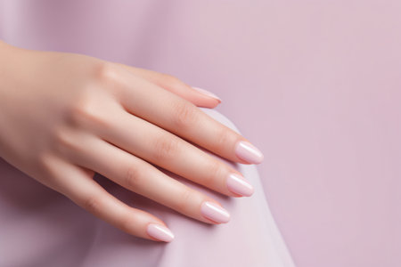 Glamour woman hand with light pink nail polish on her fingernails. Pink nail manicure with gel polish at luxury beauty salon. Nail art and design. Female hand model. French manicure. Generative AI.の素材