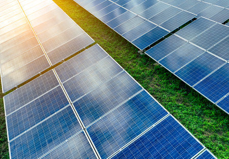 Solar farm and sun light. Solar power for green energy. Sustainable renewable energy. Photovoltaic power station or solar park. Solar panel installation and maintenance concept. Energy sustainability.の写真素材