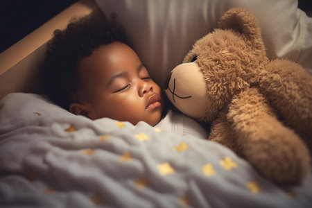 Closeup cute toddler baby sleeping on a cozy bed. Happy toddler child peaceful sleep on a comfortable bed at home. Sweet dreams. Adorable toddler naptime. Family love and tranquility. Generative AI.の素材