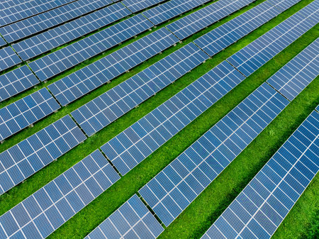 Aerial view of solar farm. Renewable energy for a sustainable future. Sustainable energy innovation. Solar energy. Clean power. Green technology.  Electricity generation. Photovoltaic power station.の写真素材