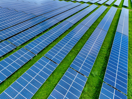 Solar farm and sun light. Solar power for green energy. Sustainable renewable energy. Photovoltaic power station or solar park. Solar panel installation and maintenance concept. Energy sustainability.の写真素材