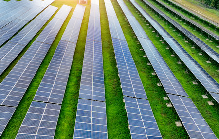 Solar farm and sun light. Solar power for green energy. Sustainable renewable energy. Photovoltaic power station or solar park. Solar panel installation and maintenance concept. Energy sustainability.の写真素材