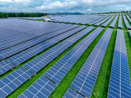 Aerial view of solar farm. Sustainable renewable energy and modern photovoltaic technology for eco-friendly electricity production. Solar power station. Green energy solutions. Solar panel technology.の写真素材