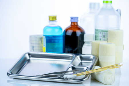 Medical equipment for treating infections. Wound care dressing set. Medical supplies for nurses. Conform bandage, forceps, cotton stick, alcohol. Sterile dressing materials. Healthcare equipment.の写真素材