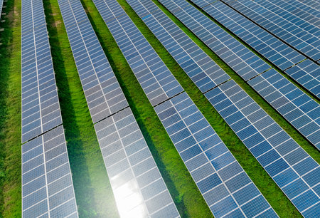 Aerial view of solar farm. Sustainable renewable energy and modern photovoltaic technology for eco-friendly electricity production. Solar power station. Green energy solutions. Solar panel technology.の写真素材