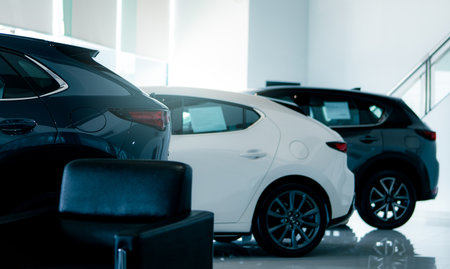 Car parked in luxury showroom. Car dealership office. Car showroom business. New car parked in modern showroom. Auto for sale and rent business. Automobile leasing and insurance. Electric automobile.の写真素材