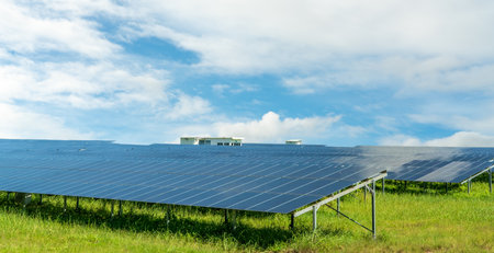Solar farm and blue sky. Sustainable renewable energy and modern photovoltaic technology for eco-friendly electricity production. Solar power station. Green energy solutions. Solar panel technology.の写真素材
