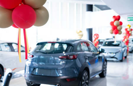Car parked in luxury showroom. Car dealership office. Car showroom business. New car parked in modern showroom. Auto for sale and rent business. Automobile leasing and insurance. Electric automobile.の写真素材