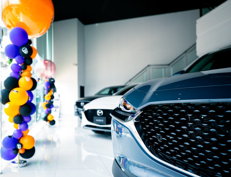 Car parked in luxury showroom. Car dealership office. Car showroom business. New car parked in modern showroom. Auto for sale and rent business. Automobile leasing and insurance. Electric automobile.の写真素材