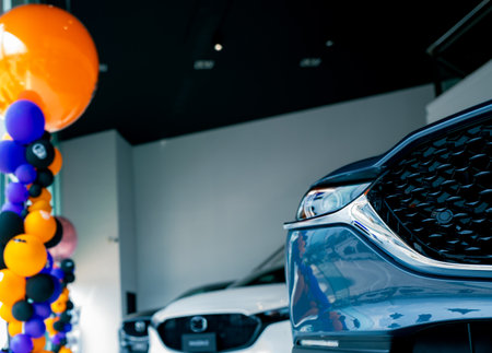 Car parked in luxury showroom. Car dealership office. Car showroom business. New car parked in modern showroom. Auto for sale and rent business. Automobile leasing and insurance. Electric automobile.の写真素材