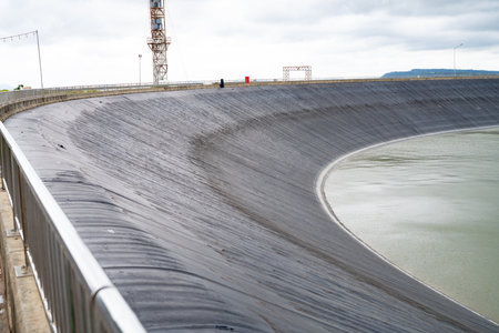 HDPE plastic lined water reservoirs and landscape of wind farm for power generating stations. High...