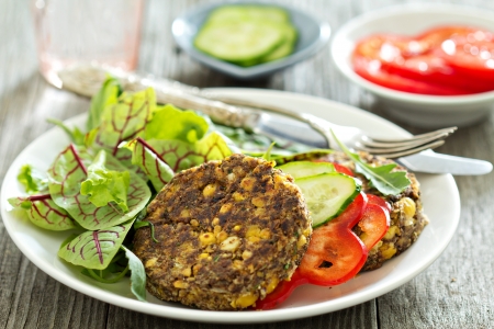 Vegan chickpeas burgers with salad and vegetablesの写真素材
