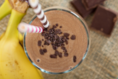 Chocolata banana smoothie in a glass from aboveの写真素材