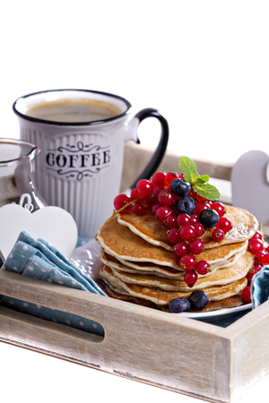 Vegan pancakes with mixed berries for breakfast isolatedの写真素材