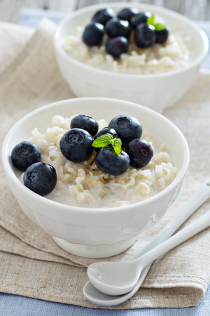 Rice pudding with syrup and berriesの写真素材