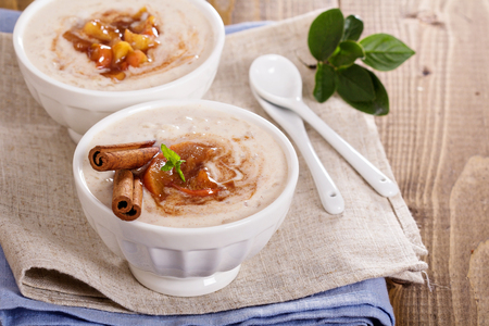 Rice pudding with syrup and berriesの写真素材