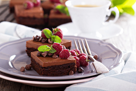 Chocolate  mousse brownies with fresh raspberries and chocolate piecesの写真素材