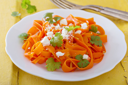 Carrot pasta salad with feta and almondsの写真素材