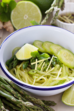 Cucumber noodles with asparagus and gingerの写真素材
