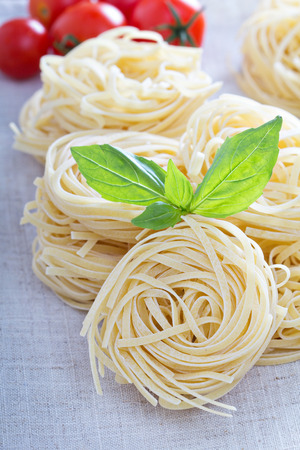 Dry pasta with fresh basilの写真素材