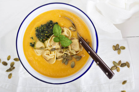 Pumpkin cream soup with cheese tortelliniの写真素材