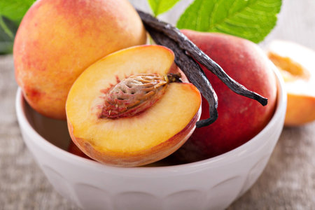 Fresh peaches in a bowlの写真素材