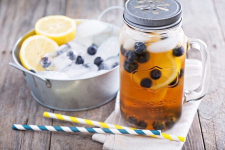 Ice tea with lemon and blueberriesの写真素材