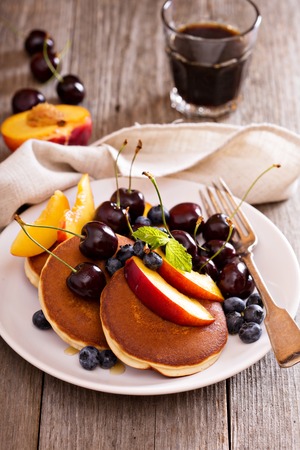 Pancakes with stone fruits, honey and blueberryの写真素材