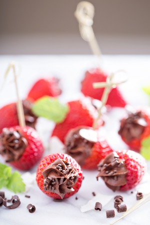 Fresh strawberries filled with healthy chocolate mousseの写真素材