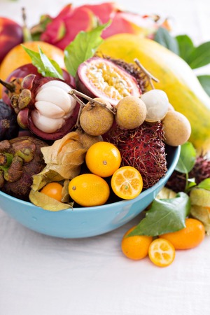 Variety of exotic fruits in a blue bowlの写真素材