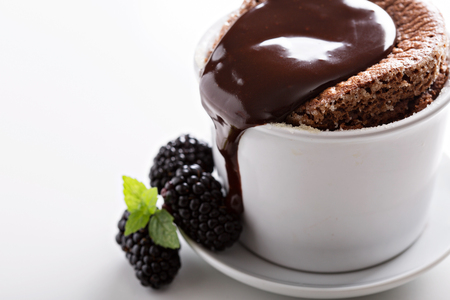 Chocolate souffle with thick chocolate ganache glazeの写真素材