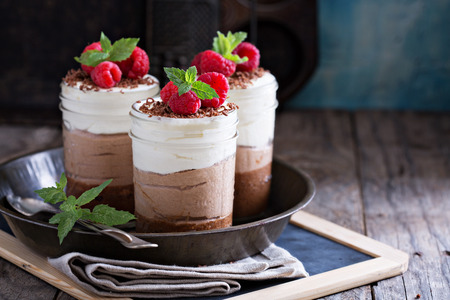 Three chocolate mousse dessert in mason jarsの写真素材