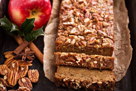 Gingerbread apple loaf cake with cinnamon and nutsの写真素材