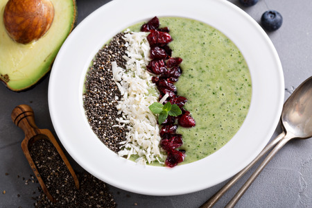 Green smoothie bowl with banana, chia seeds and fresh kale