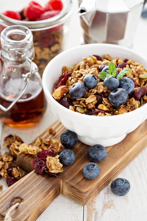 Homemade granola with berries for breakfast with coffeeの写真素材