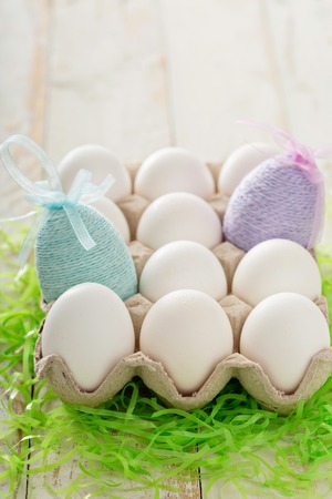 Easter background with pastel colorful speckled eggs