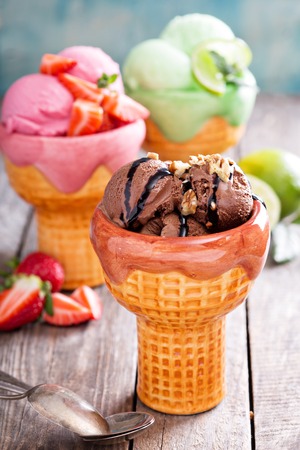 Variety of ice cream in bowls chocolate, strawberry and limeの写真素材
