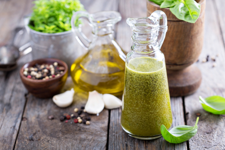 Aromatic olive oil with basil in vintage bottleの写真素材