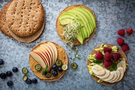 Wholegrain toast with variety of healthy toppingsの写真素材
