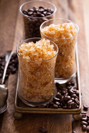 Coffee granita in small glasses with caramel syrupの写真素材
