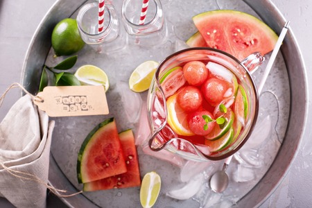 Watermelon drink with lime in a small pitcherの写真素材