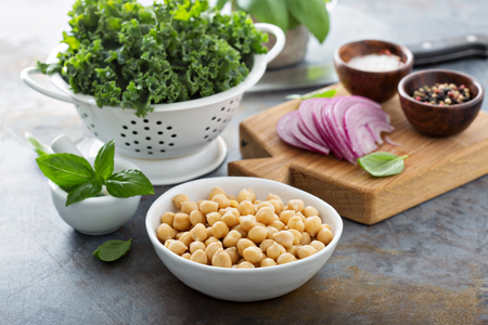 Cooking with kale and chickpeas - ingredients on the tableの写真素材