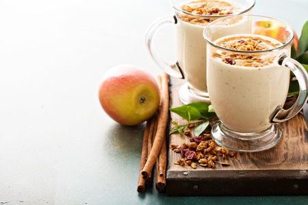 Apple pie smoothie with cinnamon and granolaの写真素材