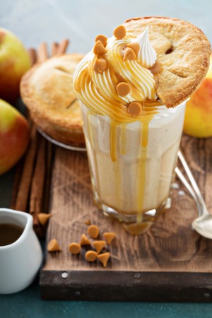 Apple pie milkshake with whipped cream and caramel syrupの写真素材