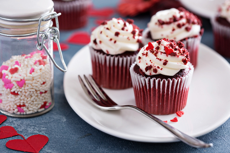 Red velvet cupcakes for Valentines Day in bright colorful settingの写真素材