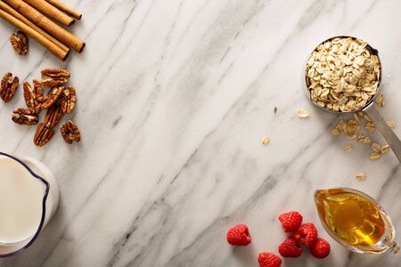 Cooking oatmeal with oats and milkの写真素材