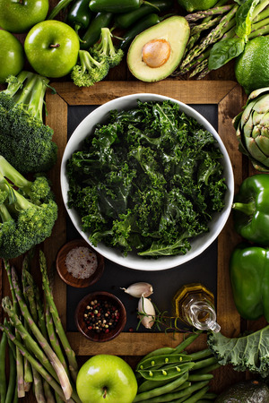 Healthy eating concept with kale salad and green vegetablesの写真素材