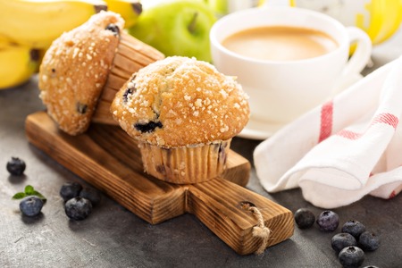 Blueberry and banana muffins with coffee for breakfastの写真素材