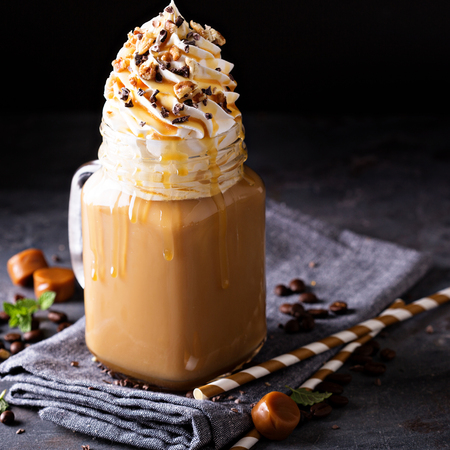 Caramel iced latte with whipped creamの写真素材